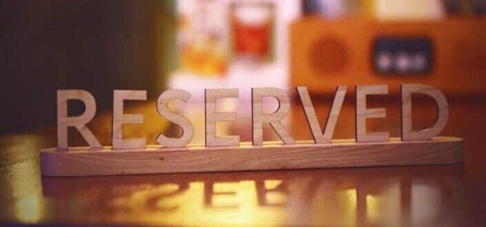 Wooden Reserved Sign on a Table